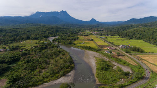 Scenic view of landscape and mountains against sky