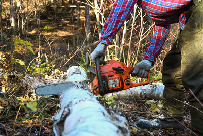 Rear view of man working on field