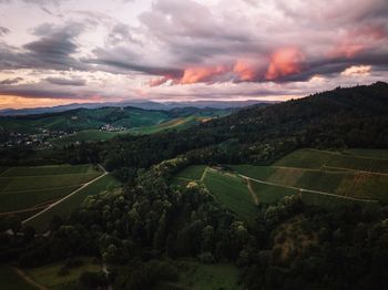 Scenic view of landscape against sky during sunset