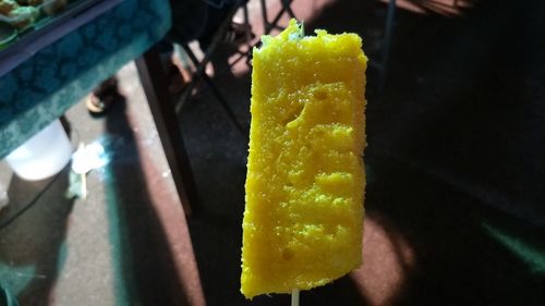 Close-up of hand holding ice cream