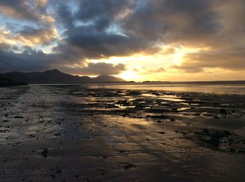 Scenic view of sea against dramatic sky