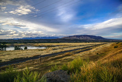 Scenic shot of calm lake against mountain range