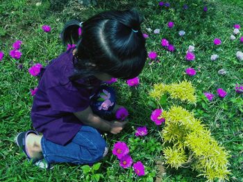 High angle view of girl with flowers