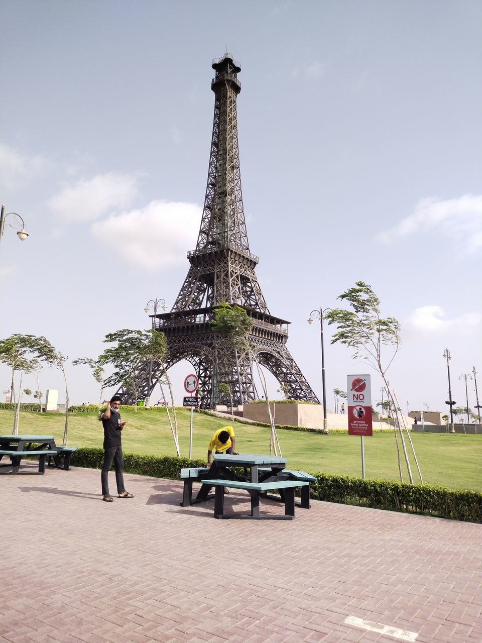 PEOPLE IN PARK AGAINST SKY