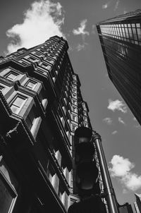 Low angle view of building against cloudy sky