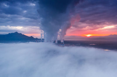 Aerial view coal power plant station in the morning mist, mae moh, lampang, thailand.