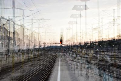 Digital composite image of train against sky