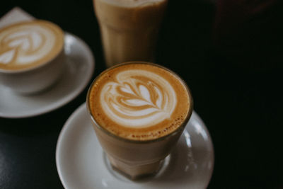 Close-up of cappuccino served on table