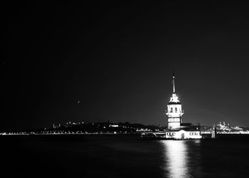 Illuminated building against sky at night