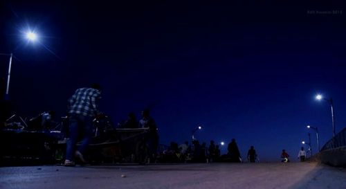 Illuminated street light at night