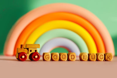 A wooden train with cubes with the inscription good luck