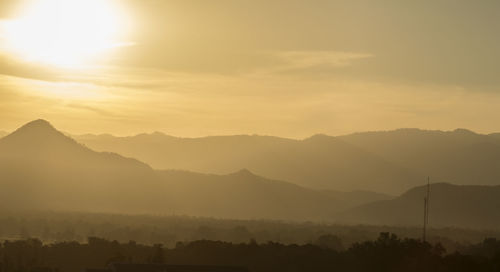 Scenic view of mountains against sky during sunset