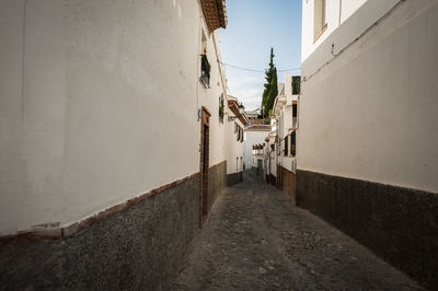 Narrow alley along buildings