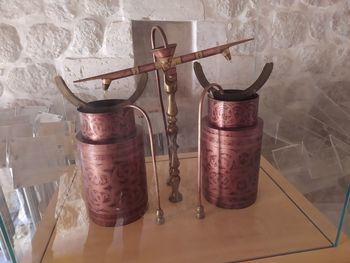 High angle view of old glass container on table