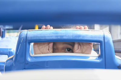 Close-up portrait of girl in car
