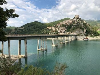 Scenic view of bridge over lake against sky