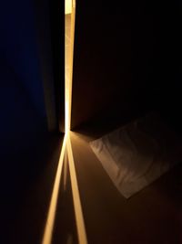 Close-up of illuminated lamp against black background