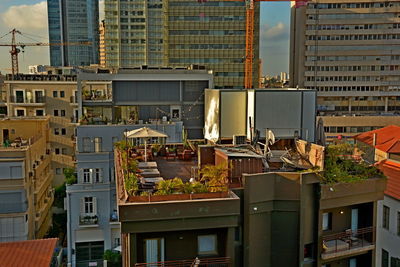 Modern buildings in city against sky