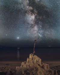 Scenic view of sea against sky at night