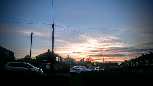 Built structure against sky at sunset