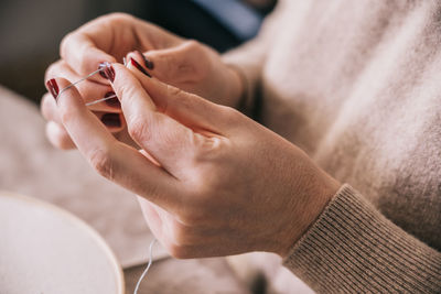 Close-up of woman holding hands