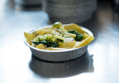 Close-up of salad in bowl on table