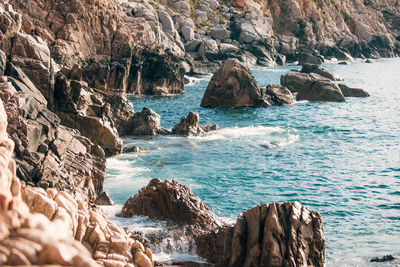 Scenic view of rocks on beach