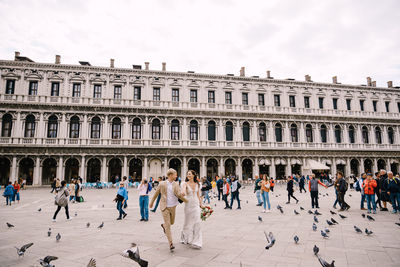 Group of people in front of historical building