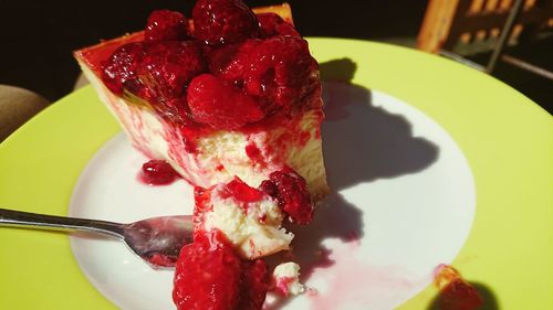 Close-up of strawberry cake in plate on table