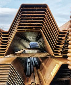 Low angle view of staircase in building against sky