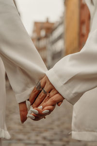  hands holding each other - couple in love