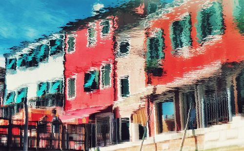 Low angle view of multi colored buildings against sky