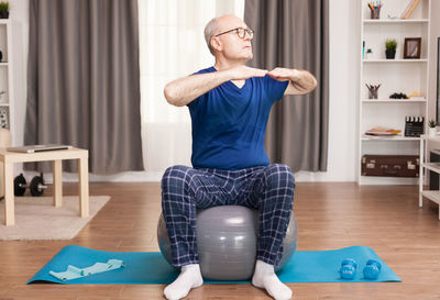 Man sitting on table at home