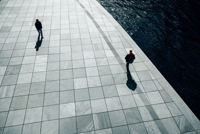 High angle view of men walking on promenade