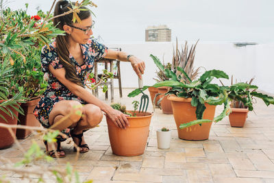 Woman gardening on terrace