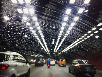 Close-up of illuminated cars at night