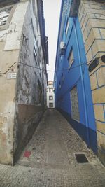 Staircase by building against sky