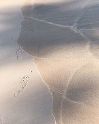 Close-up of sand on beach against sky