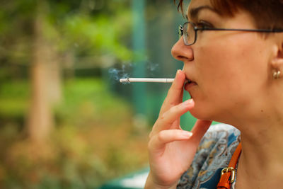Portrait of man smoking cigarette