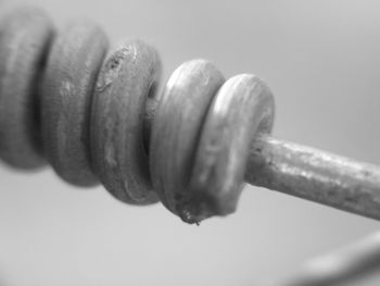 Close-up of metal chain against white background