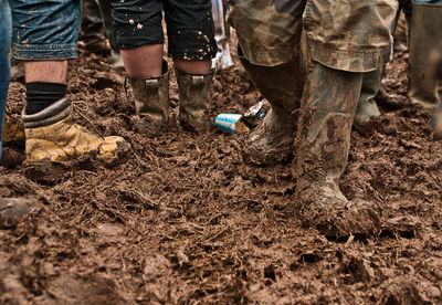 Men walking in mud