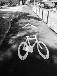 Close-up of bicycle sign on road