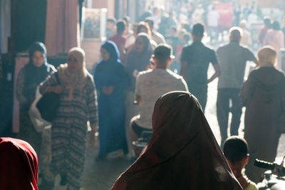 People standing on street in city