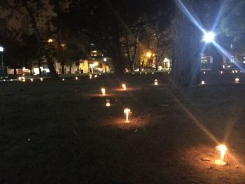 Illuminated candles at night