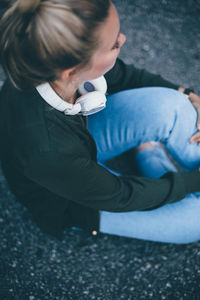 High angle view of woman sitting outdoors