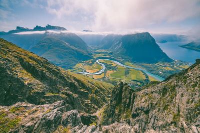 Aerial view of mountain range against sky