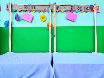 Close-up of multi colored papers on wall