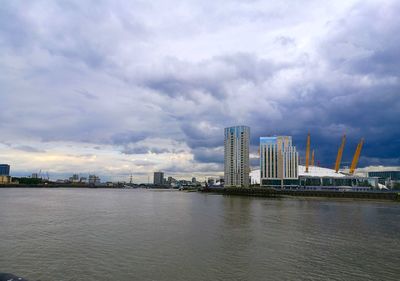 City skyline against cloudy sky