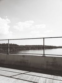 Scenic view of chainlink fence against sky