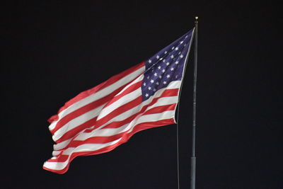 Low angle view of flag against the sky